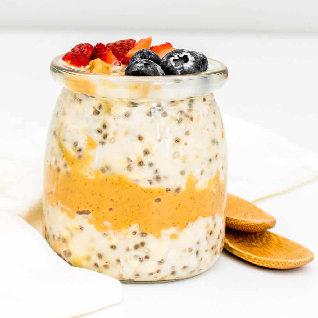 front view of glass jar with peanut butter overnight oats.
