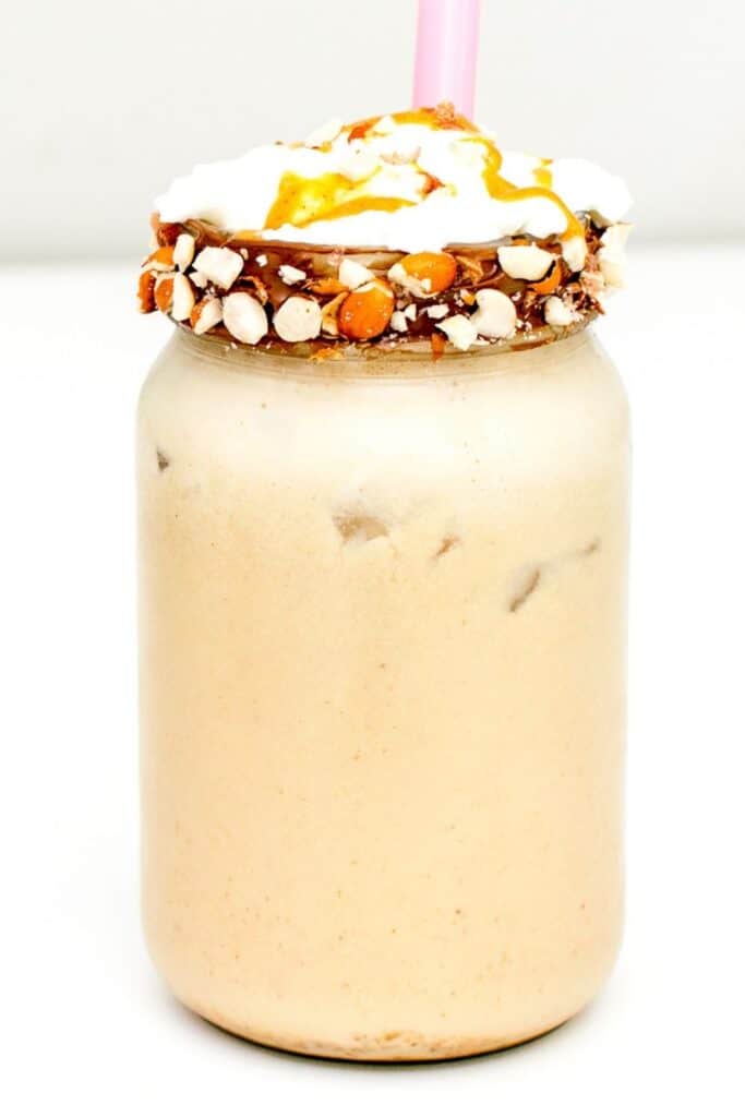 a tall front view of peanut butter milkshake.