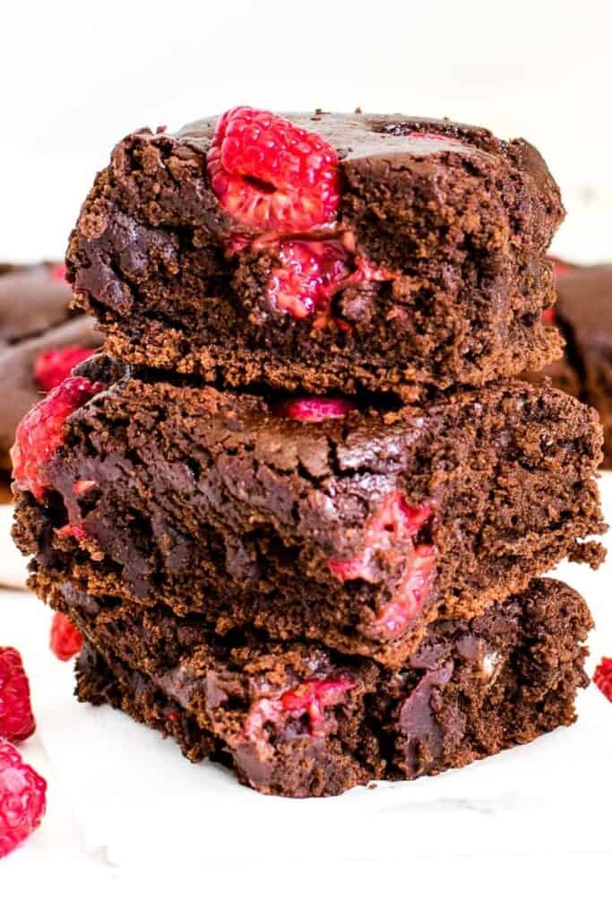 a close view of stacked raspberry brownies.