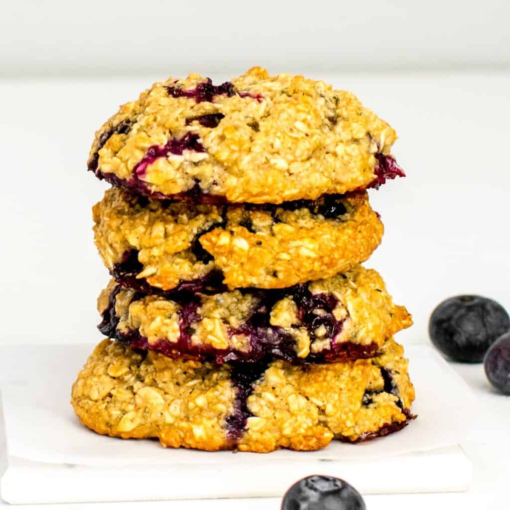 a front view of stacked blueberry oatmeal cookies.
