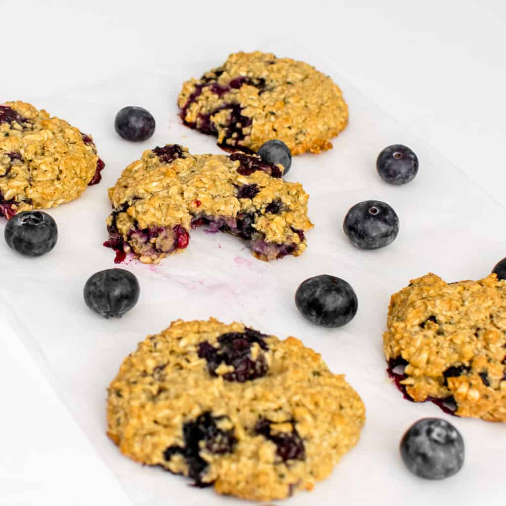 a close up view of half eaten blueberry oatmeal cookies. 