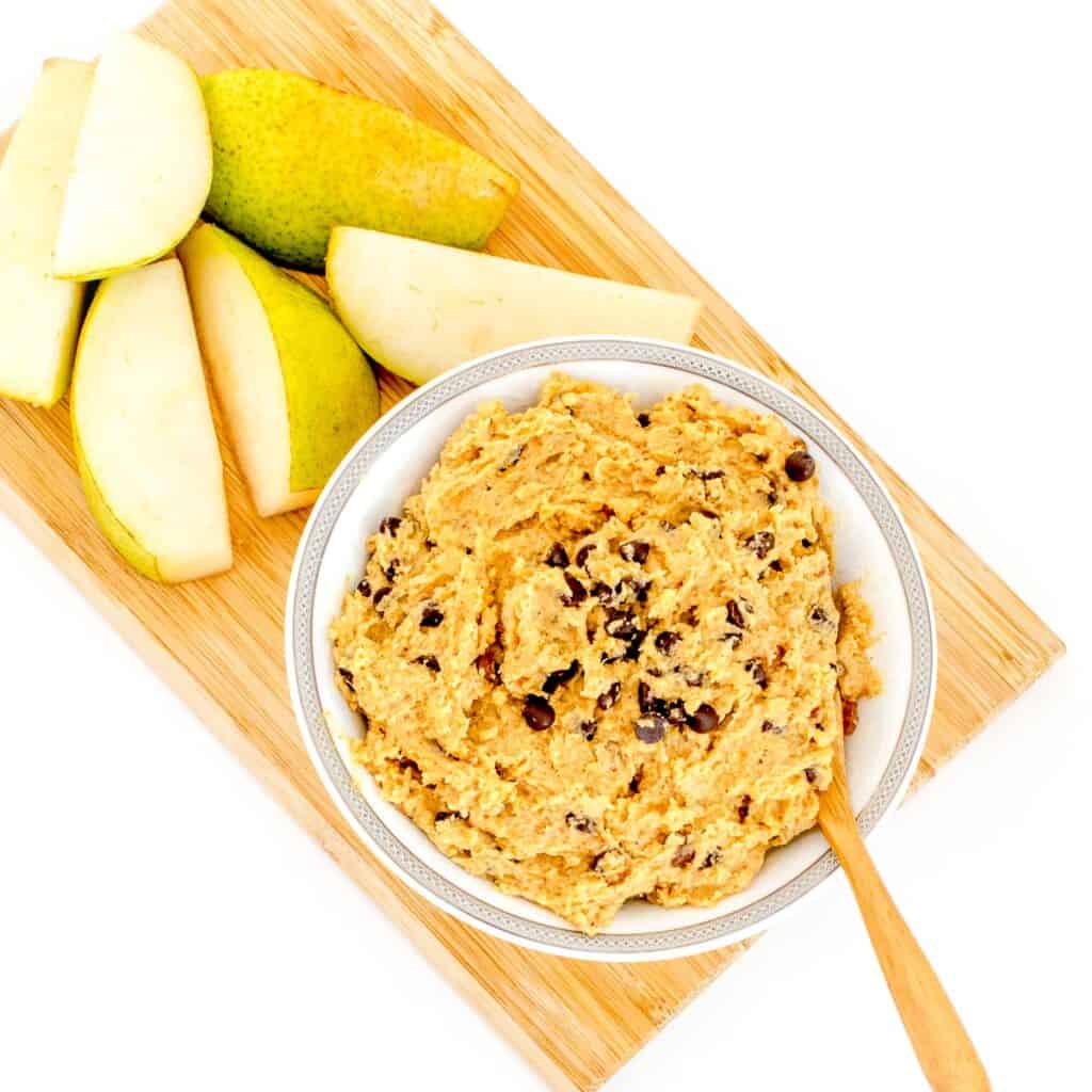 top view of chickpea cookie dough served with fruits. 