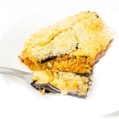 a 45 degree angle view of a big serving of vegan moussaka.