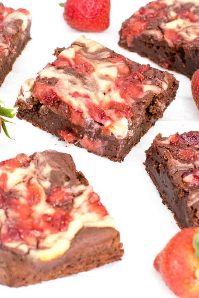 a 45 degree angle view of strawberry cheesecake brownies slices. 