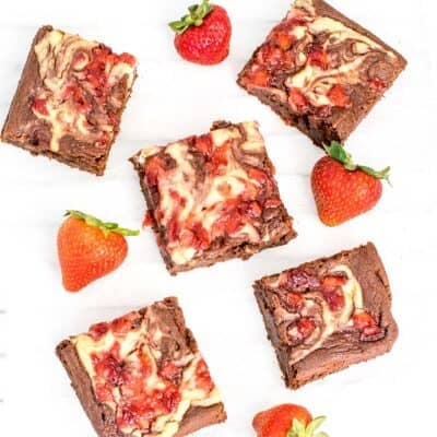 top view of scattered sliced strawberry cheesecake brownies.