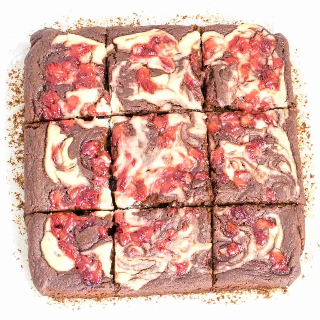 top view of sliced strawberry cheesecake brownies.