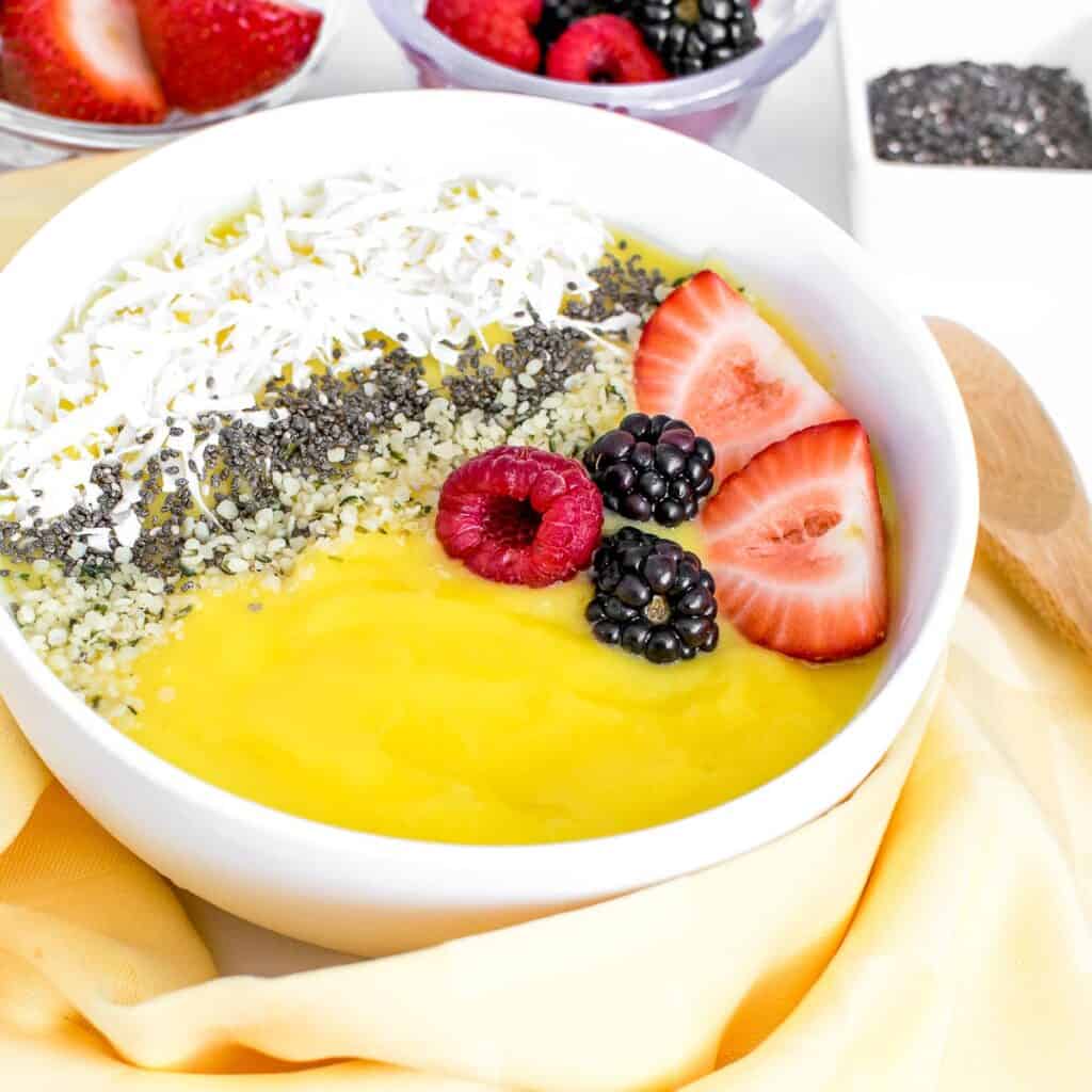 a 45 degree angle view of mango smoothie bowl.