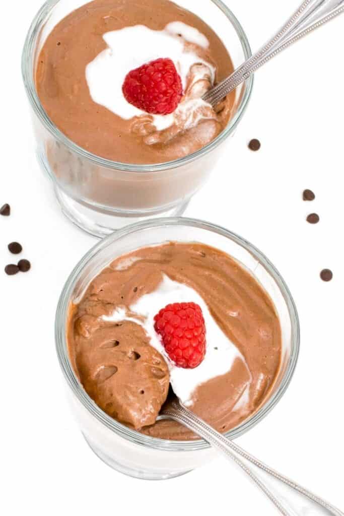 a spoon picking up vegan chocolate mousse.
