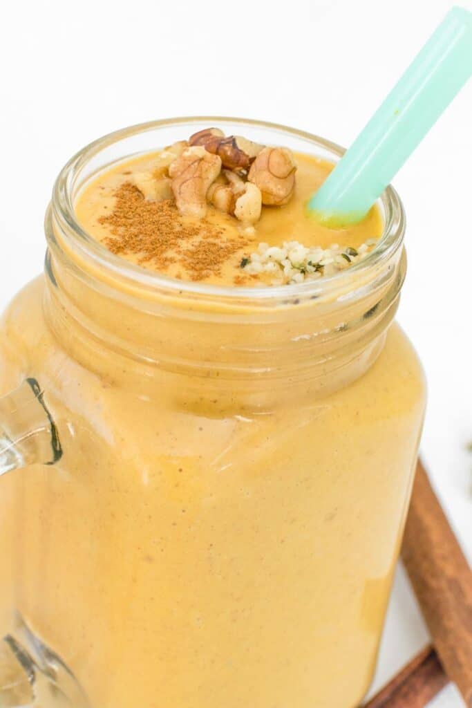 front view of a glass filled with sweet potato smoothie.