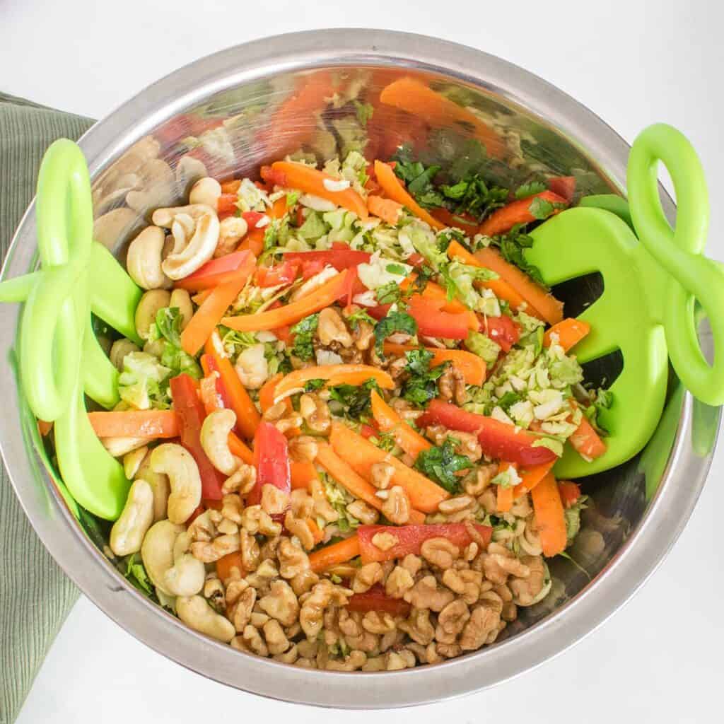 tossed vegan brussels sprout salad in a mixing bowl.