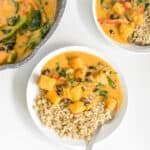 top view of served butternut squash curry with quinoa as a side.