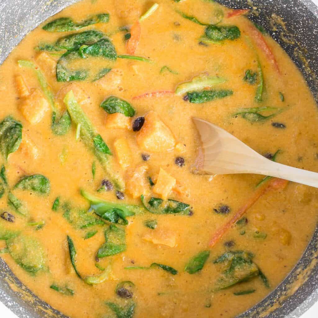 cooked butternut squash curry in the pan. 