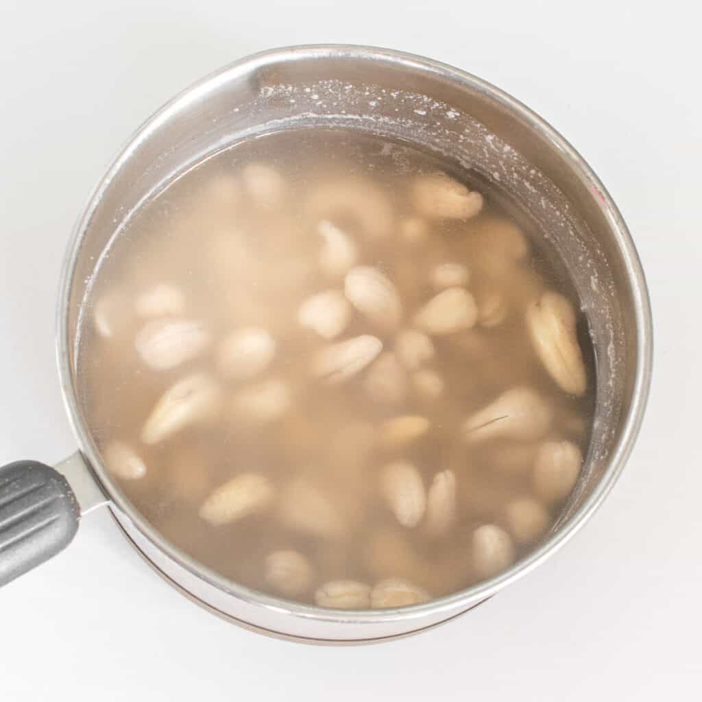 boiled cashew nuts in a saucepan.