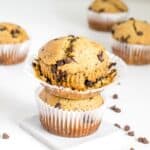 stacked vegan chocolate chip muffins with the open liner.