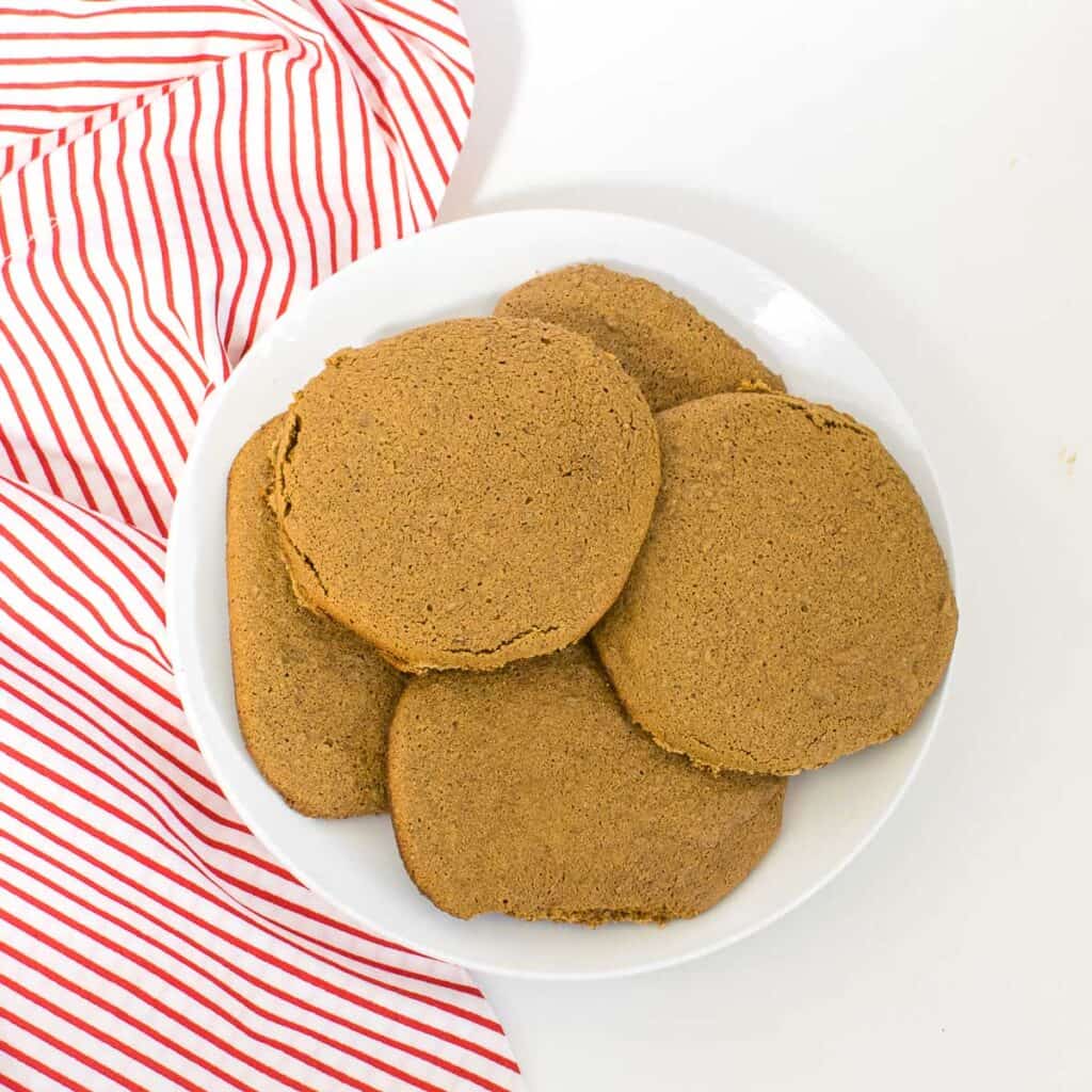 top view of vegan molasses cookies on a plate. 