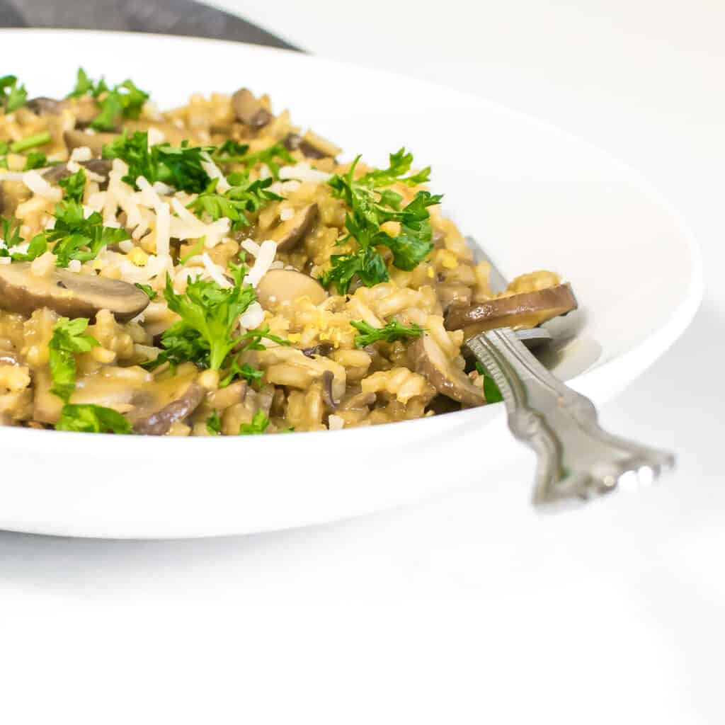 a front view of served brown rice mushroom risotto.