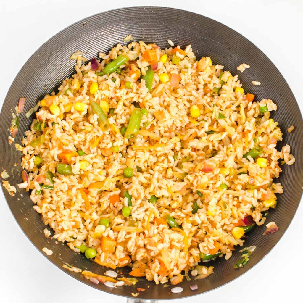 top view of schezwan fried rice in the wok. 