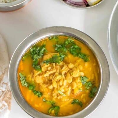 top view of served instant pot chana dal along with other side dishes.