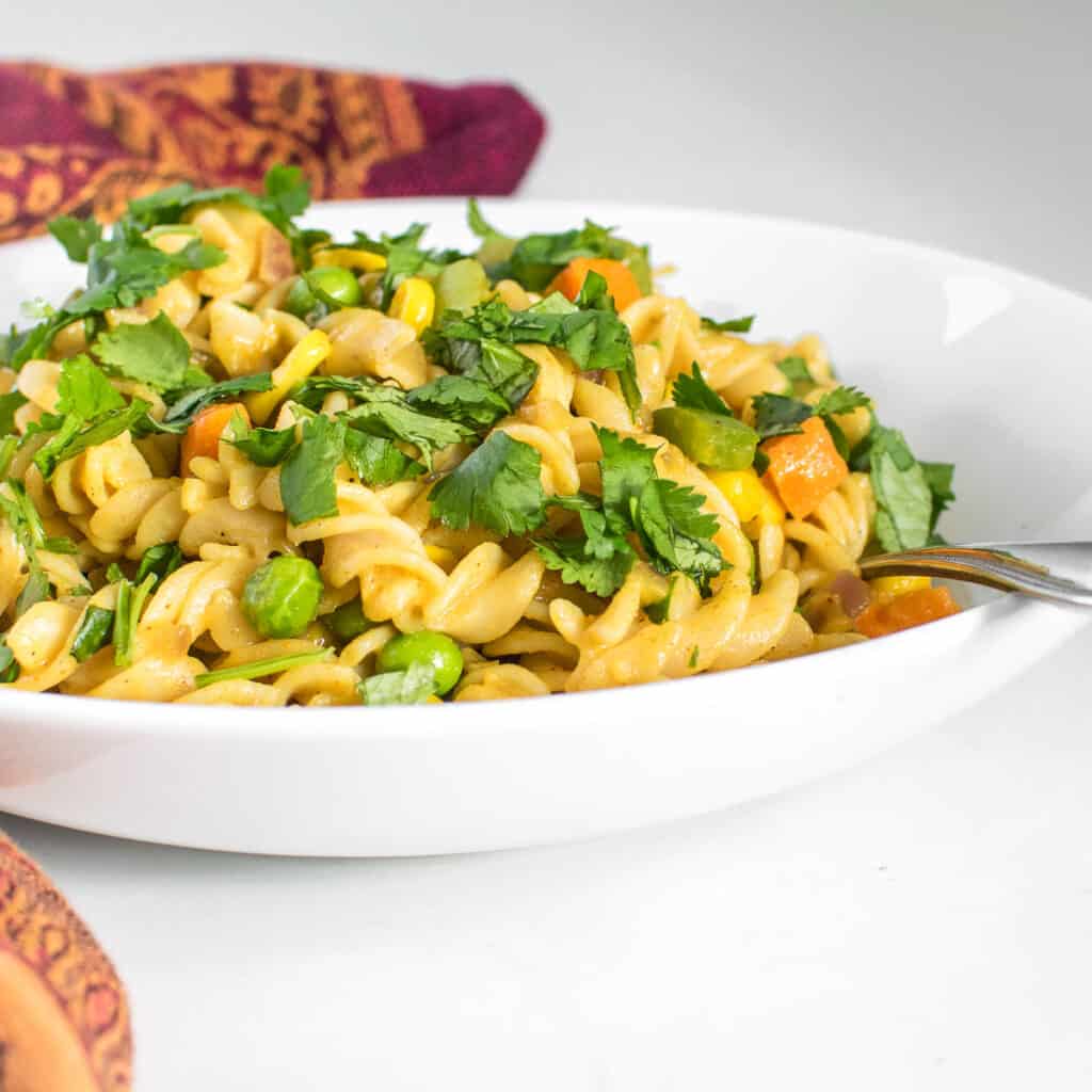 front view of served masala pasta.