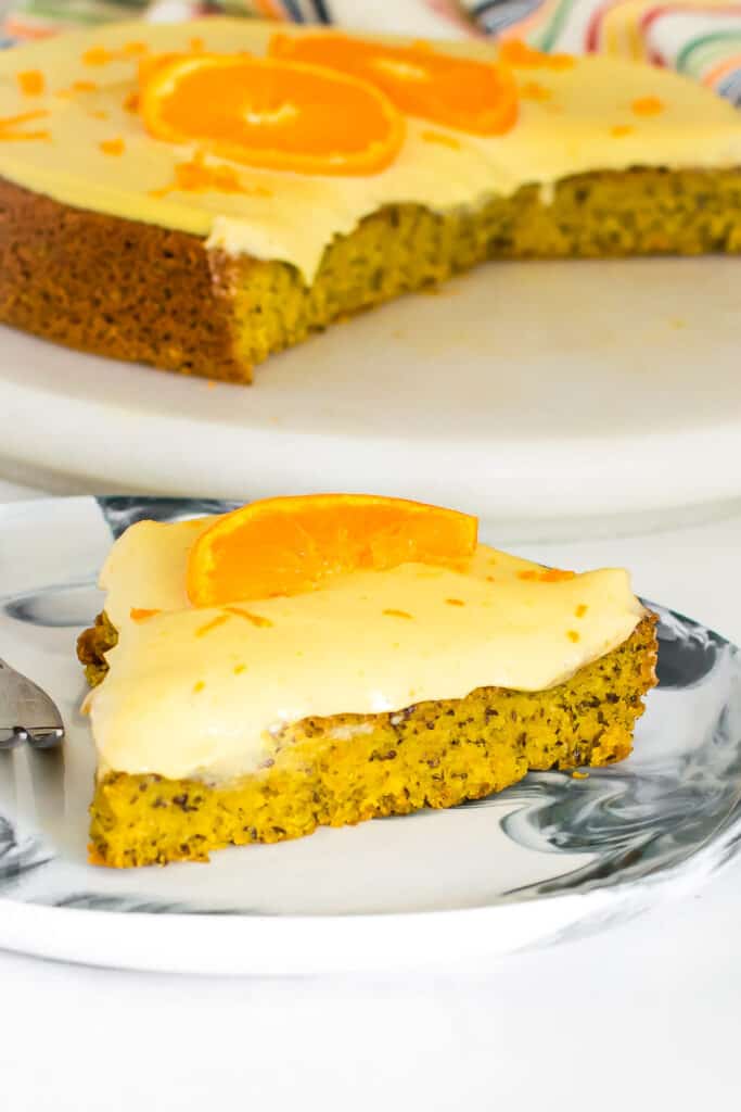 a front view of a slice of vegan orange cake. 
