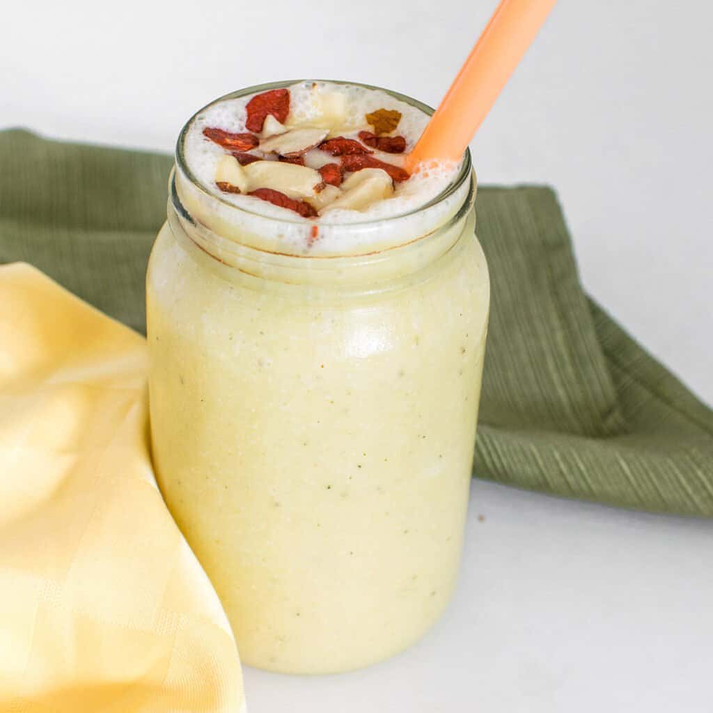 a 45 degree angle view of pineapple banana smoothie