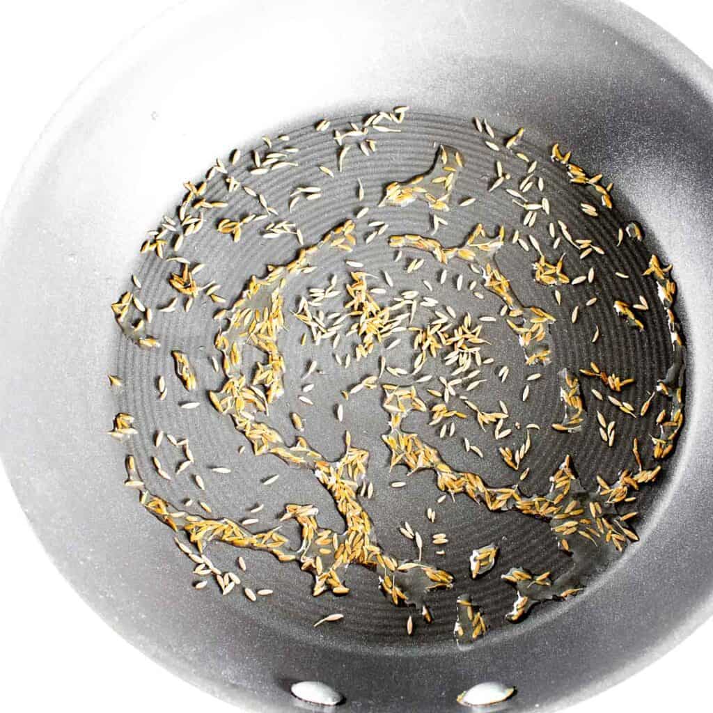 tempered cumin seeds in oil.