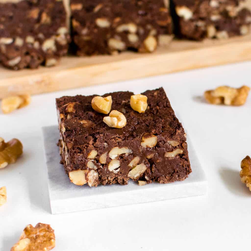 a close up view of a slice of walnut fudge.