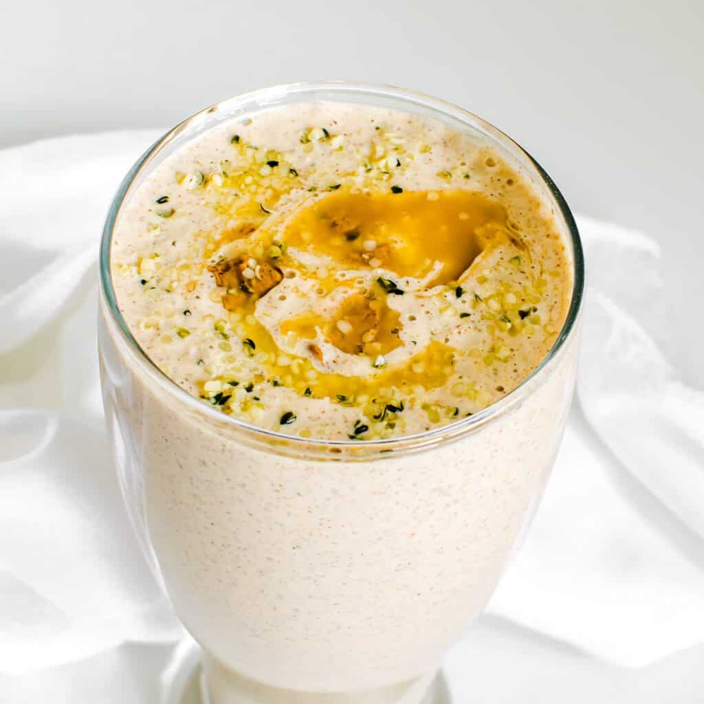 a close up view of served banana almond butter smoothie