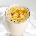 a close up view of served banana almond butter smoothie