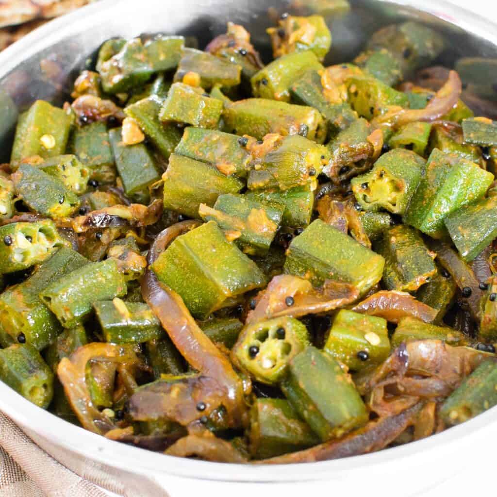 a close up view of the cooked and served bhindi masala.