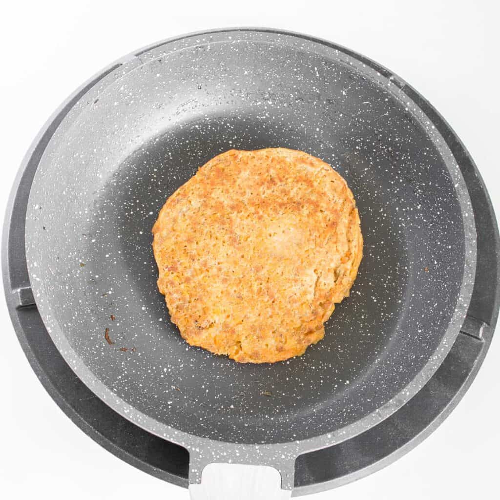 cooked carrot pancake in the pan.