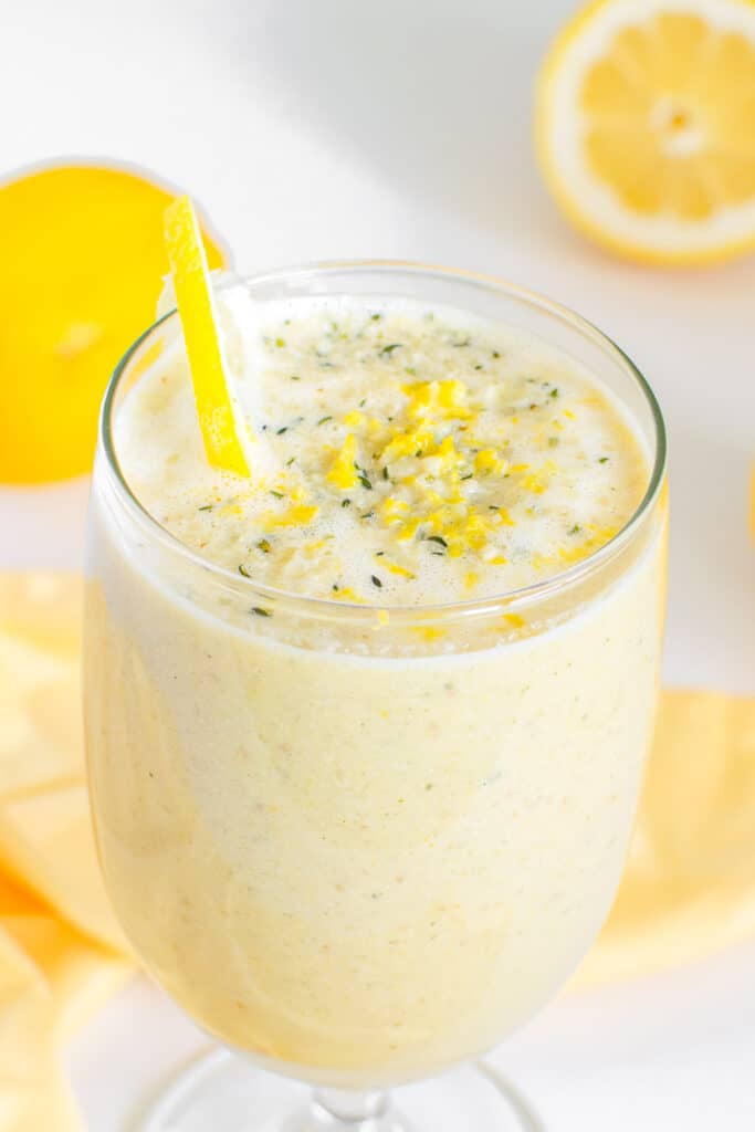 a close up view of lemon smoothie in a serving glass