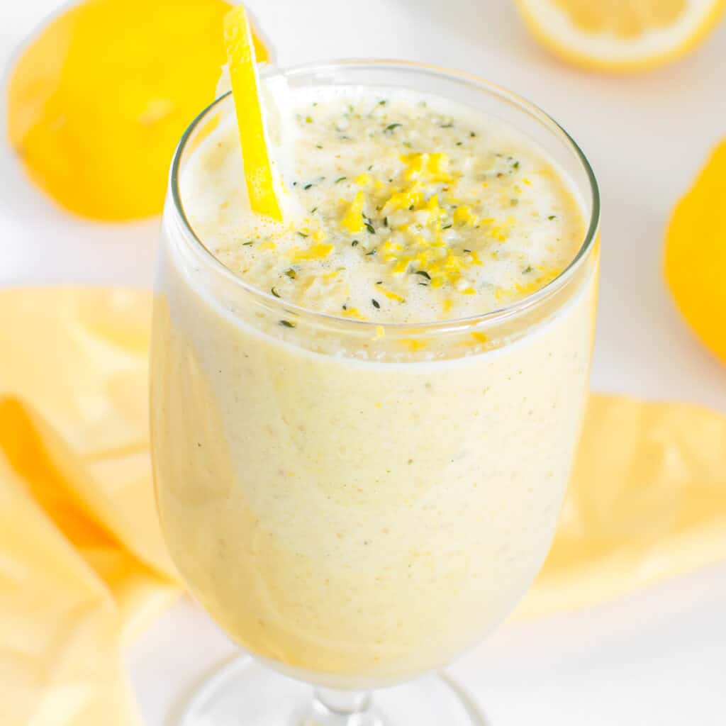 a 30 degree angle view of lemon smoothie served in a glass.