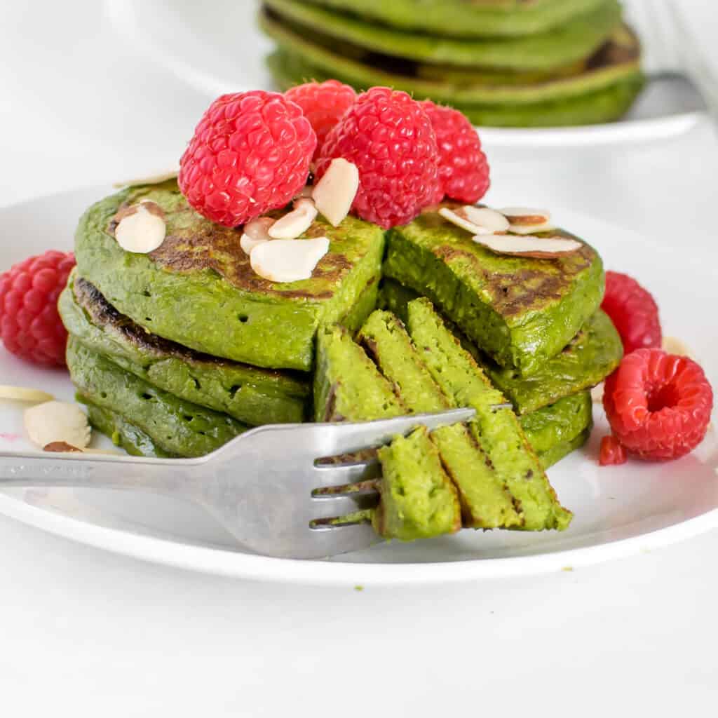 a front view of sliced spinach banana pancakes.