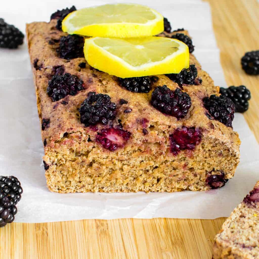 a close up view of the inside of blackberry lemon bread.