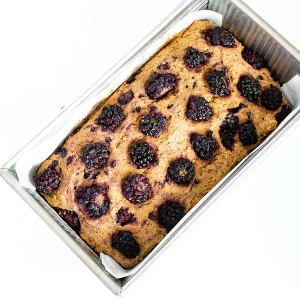 fresh baked blackberry lemon bread in the loaf pan. 