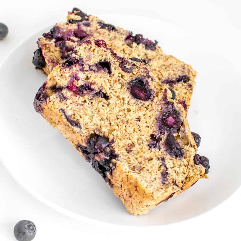 a close up view of slices of vegan blueberry bread.