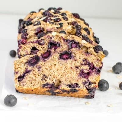 front view of stacked slices of vegan blueberry bread