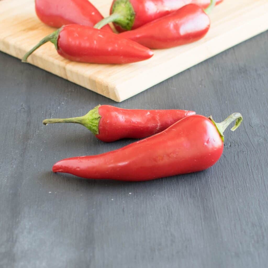 Easy and lip-smacking Vegetables in Chili Garlic Sauce is absolutely similar to the famous Asian Huy Fong spicy sauce. Its garlicky and spicy made from scratch at home with the same comforting taste and no preservatives | kiipfit.com