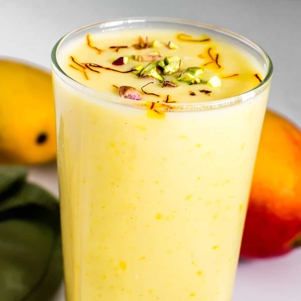 a close up view of vegan mango lassi.