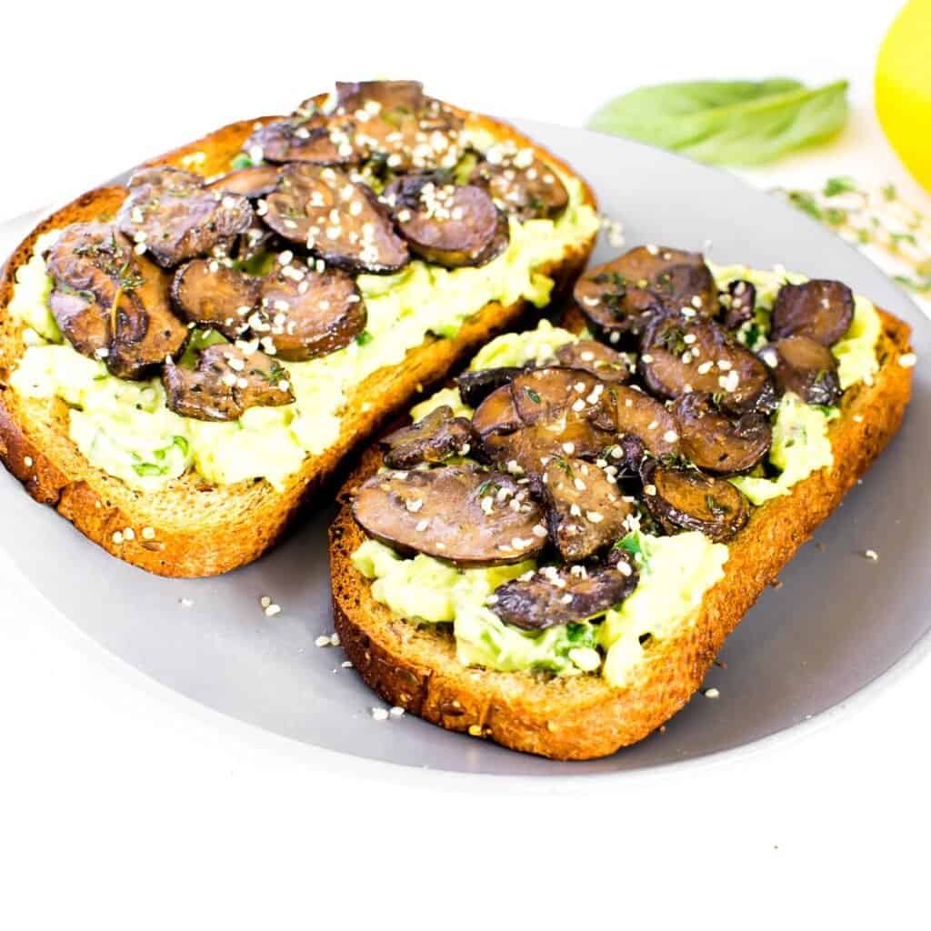 a 45 degree angle view of served mushroom avocado toast.