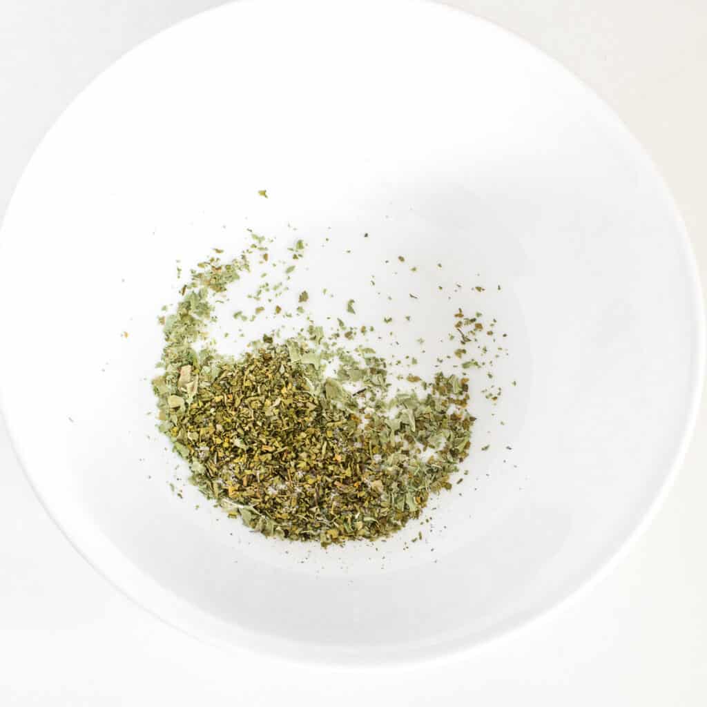 all the herbs in a mixing bowl. 