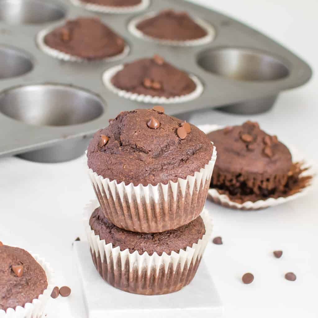 a front view of stacked vegan chocolate muffins.