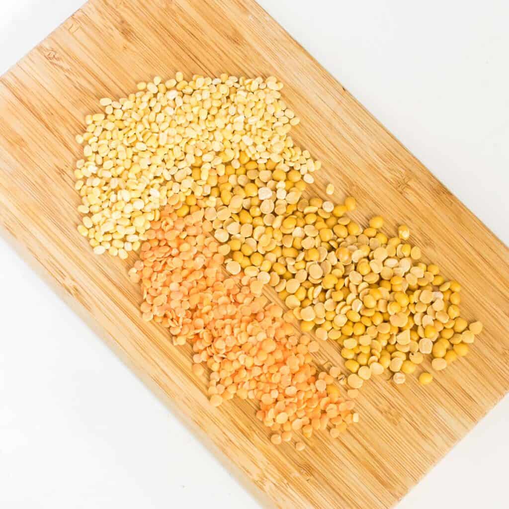 raw lentils on a wooden board.