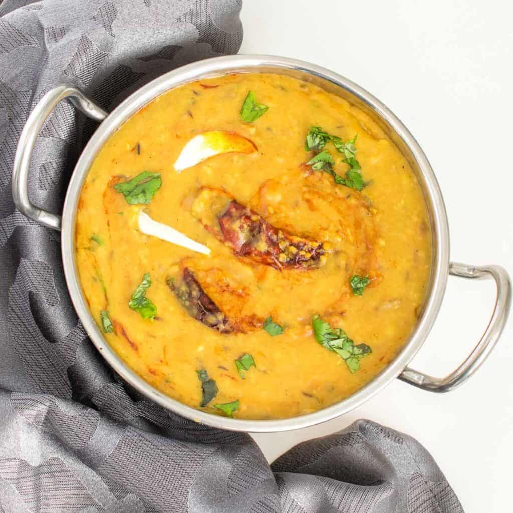 top view of dal tadka in a kadhai. 