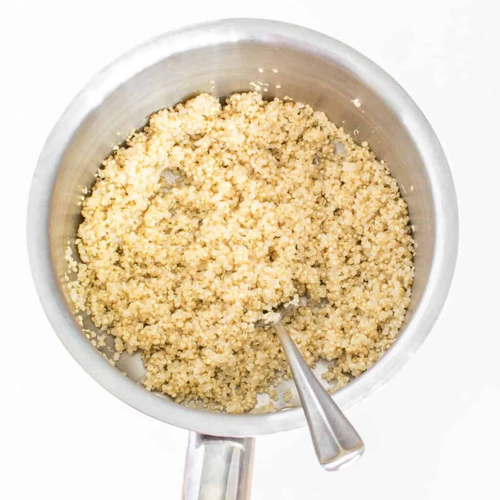 cooked quinoa in a saucepan.