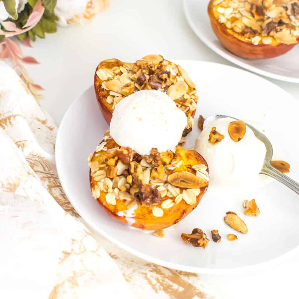 30 degree angle view of served air fryer peaches with ice cream. 