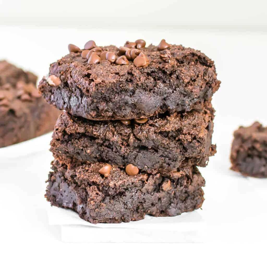 a front view of stacked almond flour brownies.