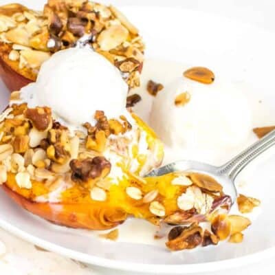 a 45 degree angle view a spoonful of air fryer peaches.