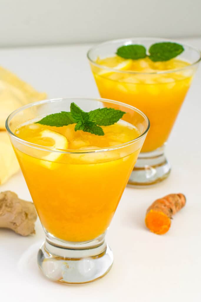 tall glasses served with turmeric ginger lemonade. 